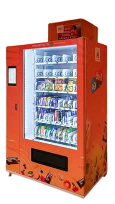 A vending machine stands in a building's corridor.